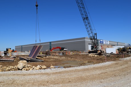 6-9-22: Crane lifting concrete forms 